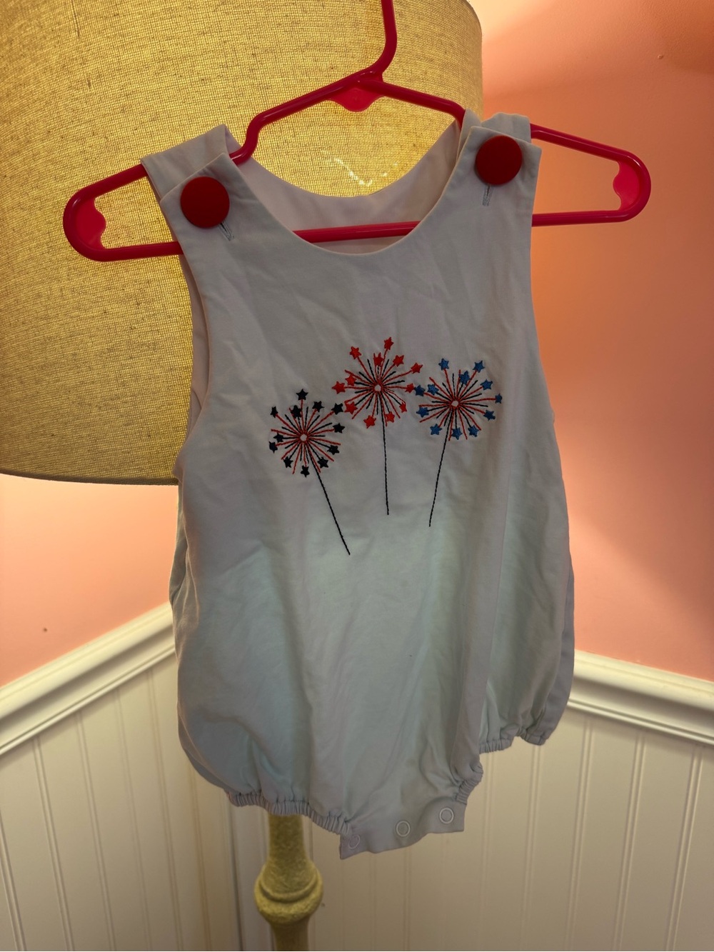 Sleeveless Baby One-Piece with Red & Blue Starburst Embroidery
